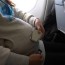 4k asian pregnant woman fastening seat