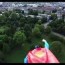 superman toy taped to flying drone is