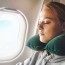 how to sleep on a plane where to sit