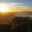 drone shot sunrise over hills with