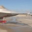 qf 4 drone taxies by an f 22 at tyndall afb