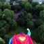 superman action figure takes flight in