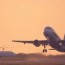 airplane takes off at dawn aircraft