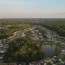 aerial view around sunlit suburbs in