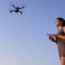 woman flying drone royalty free photo