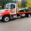 towing truck green tree