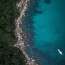 drone shot ocean trees top view