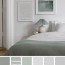 light grey bedroom with sage accents