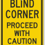 blind corner proceed with caution sign