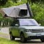 land rover with rooftop tent road