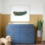 nursery with blue campaign dresser and