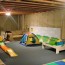 an unfinished basement playroom