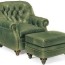 green leather tufted armchair and ottoman